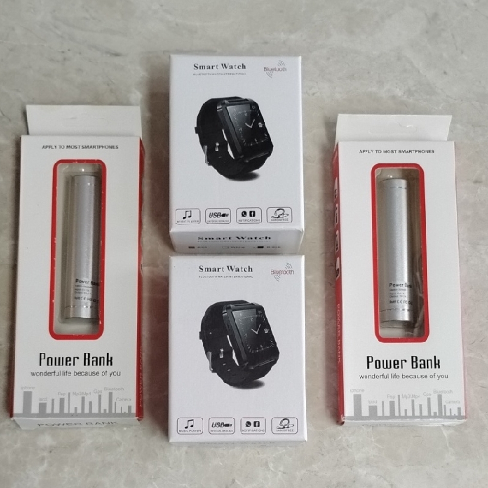 One Lot Of TWO Smart Watches & TWO Power Banks - All NIB